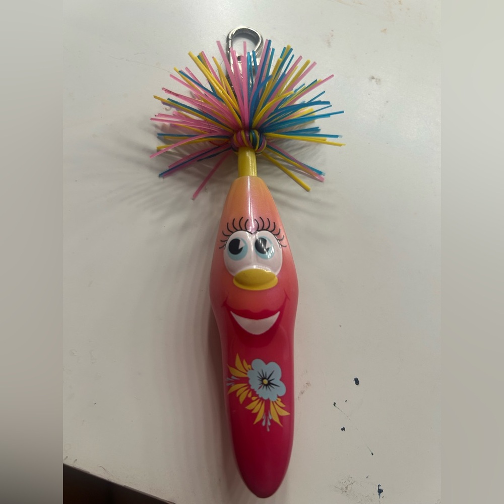 Colorful Character Toy with Floral Design